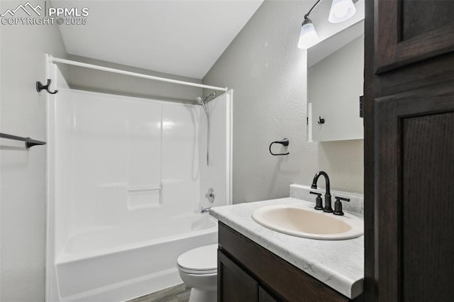 4680 Pika Pt, Colorado Springs, CO 80922 - full bath featuring vanity, washtub / shower combination, a textured wall, and wood finished floors