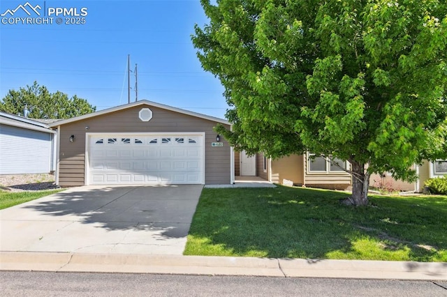 4680 Pika Pt, Colorado Springs, CO 80922 - view of front of property with driveway, a front lawn, and an attached garage