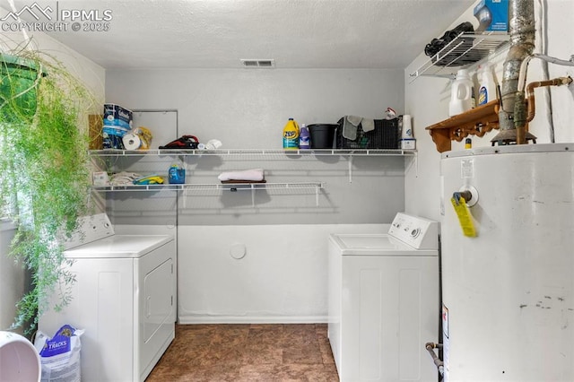 8991 Hickory Pl, Thornton, CO 80229 - laundry area with gas water heater and washer and dryer