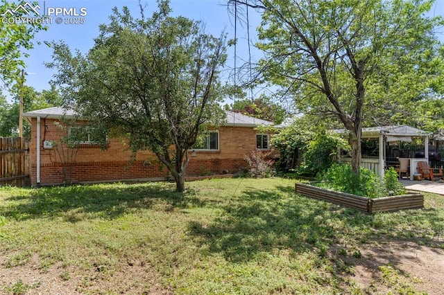 8991 Hickory Pl, Thornton, CO 80229 - view of yard featuring a garden and a gazebo