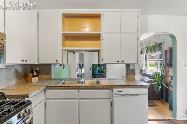 8991 Hickory Pl, Thornton, CO 80229 - kitchen featuring appliances with stainless steel finishes, open shelves, and white cabinetry