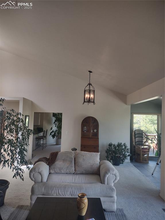 423 Ridge Rd, Divide, CO 80814 - carpeted living area featuring a chandelier