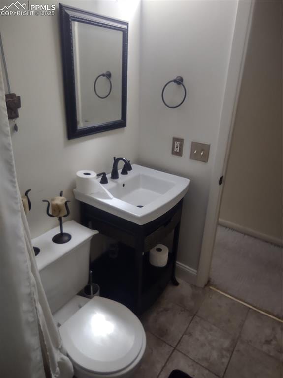 423 Ridge Rd, Divide, CO 80814 - bathroom with tile patterned floors and toilet