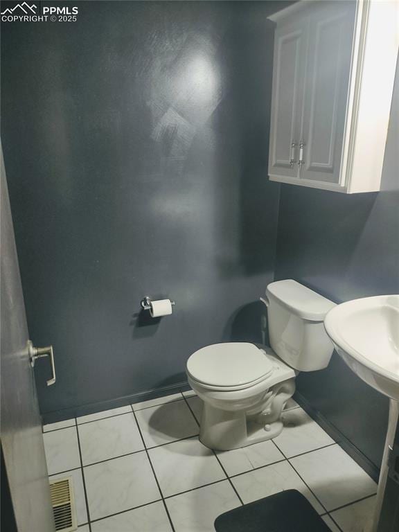 423 Ridge Rd, Divide, CO 80814 - bathroom featuring toilet and tile patterned floors