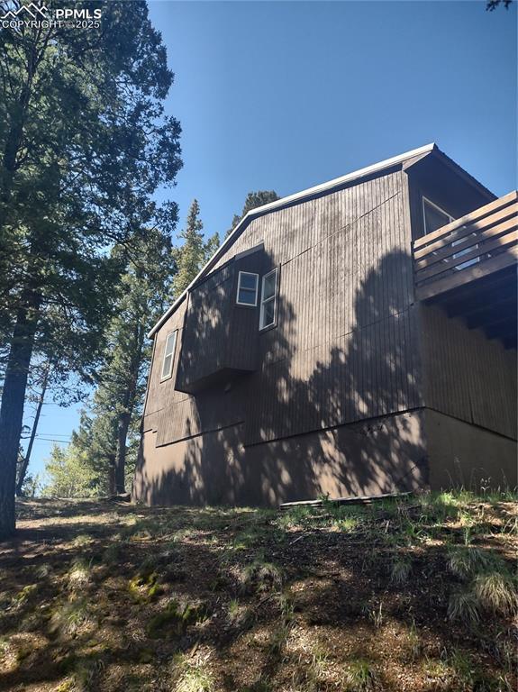 423 Ridge Rd, Divide, CO 80814 - view of side of home with a balcony and a barn