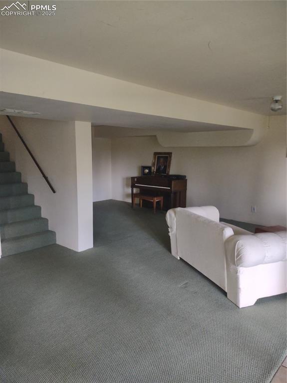 423 Ridge Rd, Divide, CO 80814 - living area featuring carpet and stairway