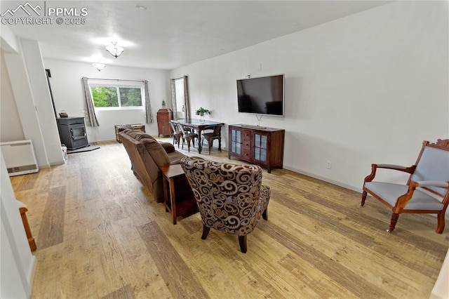 1522 Monarch Dr, Cripple Creek, CO 80813 - living area with a wood stove and light wood finished floors