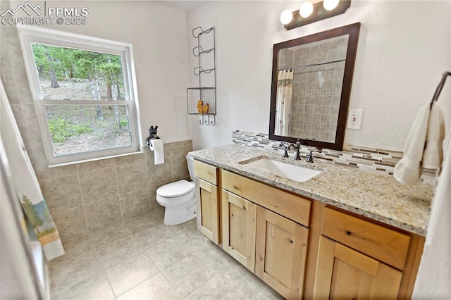 1522 Monarch Dr, Cripple Creek, CO 80813 - bathroom with vanity, tile patterned flooring, tile walls, and curtained shower