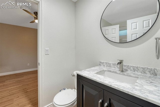 123 Wheat Ridge St, Palmer Lake, CO 80133 - bathroom featuring a ceiling fan, vanity, and wood finished floors