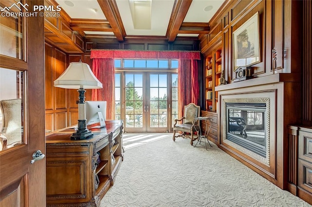 910 Grey Mountain Pt, Colorado Springs, CO 80906 - sitting room with carpet flooring, built in shelves, coffered ceiling, french doors, and wooden walls