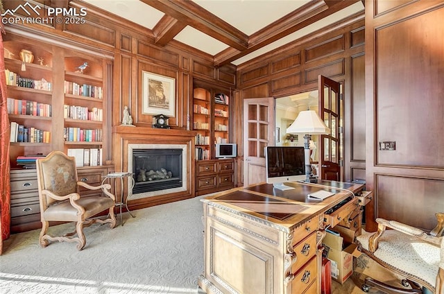 910 Grey Mountain Pt, Colorado Springs, CO 80906 - carpeted office space featuring built in shelves, a decorative wall, wood walls, ornamental molding, and coffered ceiling