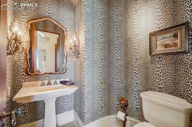910 Grey Mountain Pt, Colorado Springs, CO 80906 - bathroom with toilet and wallpapered walls