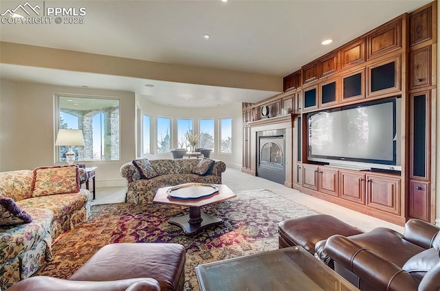 910 Grey Mountain Pt, Colorado Springs, CO 80906 - living room featuring carpet, recessed lighting, and a lit fireplace