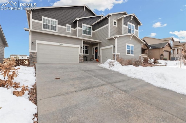 13437 Park Meadows Dr, Peyton, CO 80831 - view of front of property featuring an attached garage, driveway, and stone siding