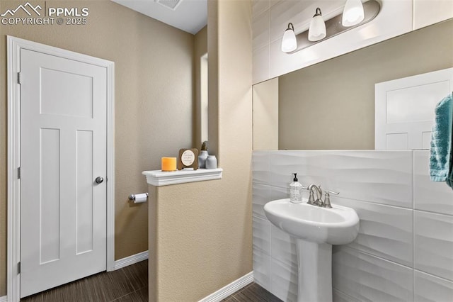 13437 Park Meadows Dr, Peyton, CO 80831 - bathroom with baseboards and wood finished floors