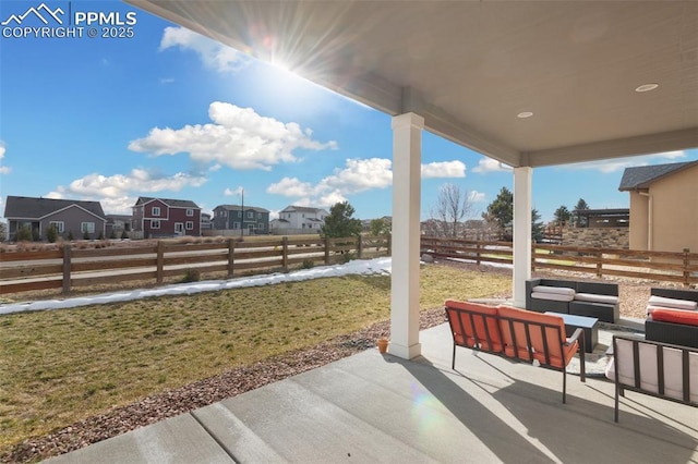 13437 Park Meadows Dr, Peyton, CO 80831 - fenced backyard with an outdoor hangout area, a patio area, and a residential view