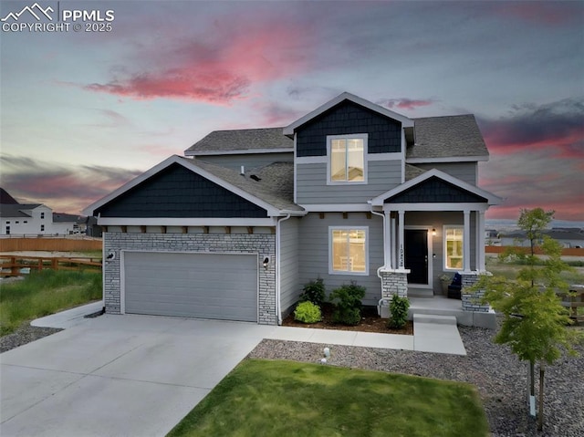 10238 Odin Dr, Colorado Springs, CO 80924 - craftsman inspired home with concrete driveway, a garage, and a shingled roof