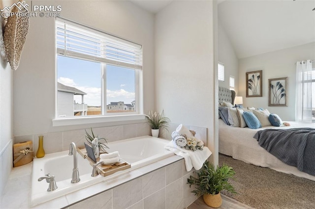 10238 Odin Dr, Colorado Springs, CO 80924 - bathroom with ensuite bath, a garden tub, and lofted ceiling