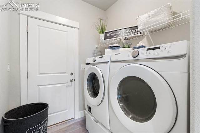 10238 Odin Dr, Colorado Springs, CO 80924 - laundry room with separate washer and dryer and wood finished floors