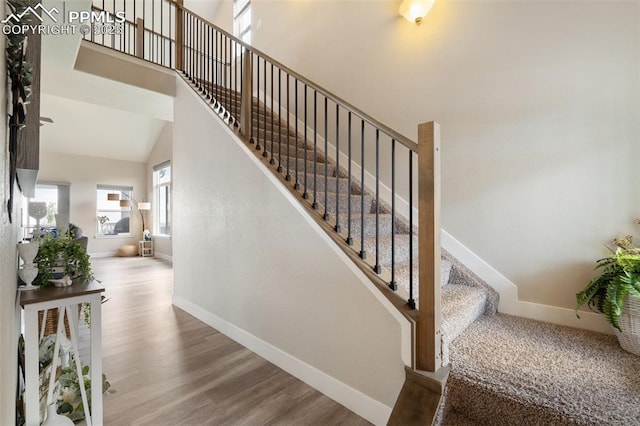 10238 Odin Dr, Colorado Springs, CO 80924 - stairs with wood finished floors and a high ceiling