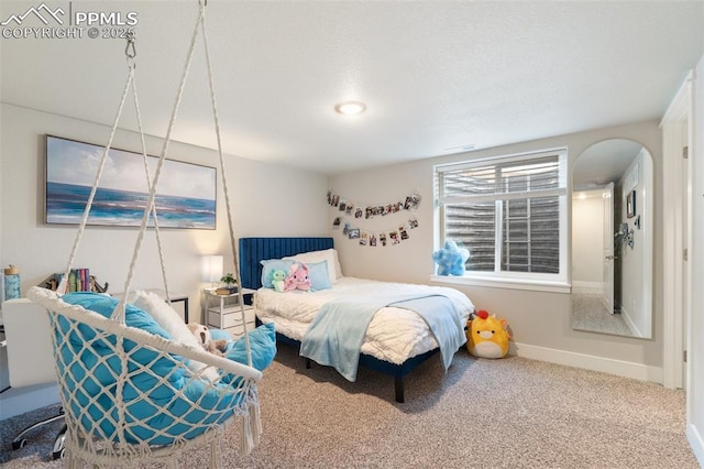 10238 Odin Dr, Colorado Springs, CO 80924 - carpeted bedroom with arched walkways and baseboards