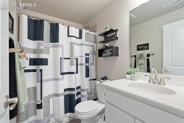 10238 Odin Dr, Colorado Springs, CO 80924 - full bathroom featuring vanity, a textured wall, and a shower with shower curtain