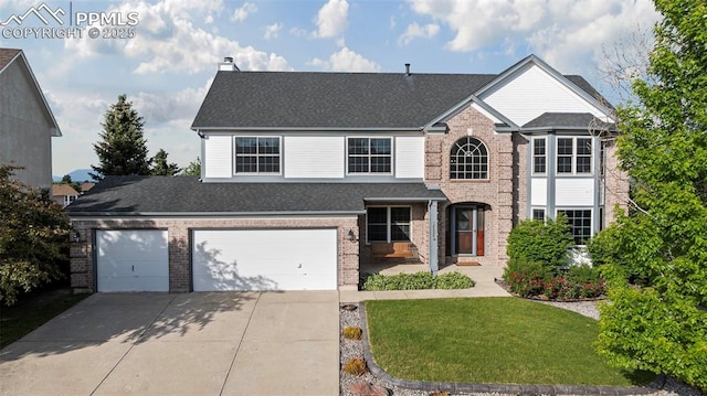 2505 Wimbleton Ct, Colorado Springs, CO 80920 - traditional-style home featuring brick siding, driveway, a front lawn, and roof with shingles