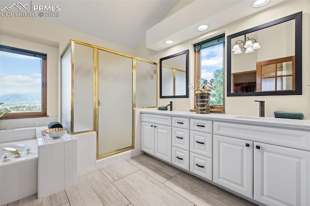 2505 Wimbleton Ct, Colorado Springs, CO 80920 - full bathroom featuring double vanity, a garden tub, a stall shower, lofted ceiling, and recessed lighting