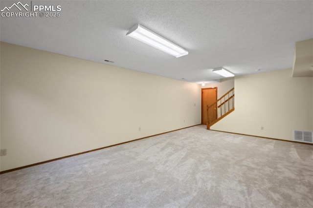 2505 Wimbleton Ct, Colorado Springs, CO 80920 - carpeted spare room with stairway and a textured ceiling