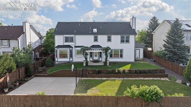 2505 Wimbleton Ct, Colorado Springs, CO 80920 - rear view of house with a fenced backyard, a chimney, and a patio