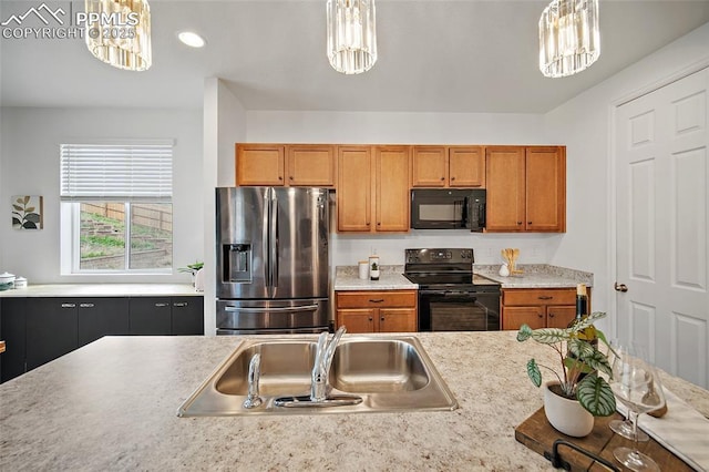 4867 Wolf Moon Dr, Colorado Springs, CO 80911 - kitchen featuring black appliances, a chandelier, light countertops, brown cabinetry, and recessed lighting