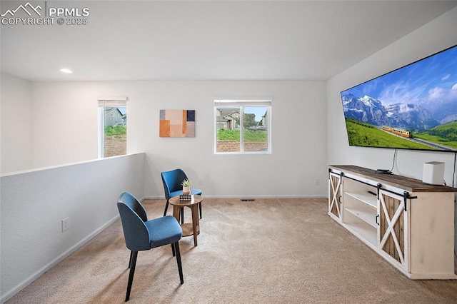 4867 Wolf Moon Dr, Colorado Springs, CO 80911 - living area with carpet, healthy amount of natural light, and recessed lighting