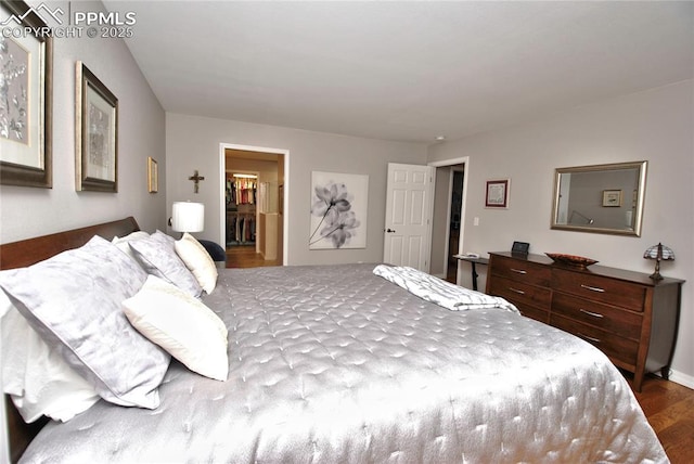 4201 Stonesthrow Vw, Colorado Springs, CO 80922 - bedroom featuring dark wood-style flooring and a walk in closet