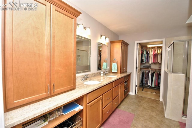 4201 Stonesthrow Vw, Colorado Springs, CO 80922 - full bathroom featuring a stall shower, double vanity, a walk in closet, and tile patterned floors