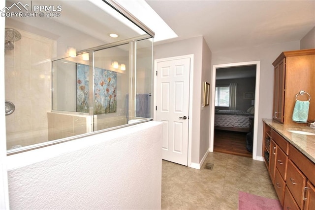 4201 Stonesthrow Vw, Colorado Springs, CO 80922 - ensuite bathroom featuring tiled shower and vanity