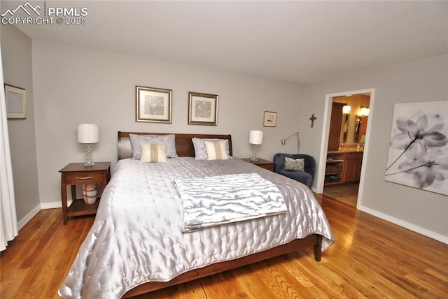 4201 Stonesthrow Vw, Colorado Springs, CO 80922 - bedroom featuring wood finished floors and ensuite bathroom