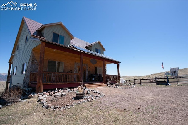 1160 Diamond Back Trl, Canon City, CO 81212 - view of front of home with a metal roof and a mountain view