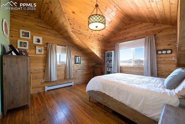 1160 Diamond Back Trl, Canon City, CO 81212 - bedroom with a baseboard radiator, wood walls, vaulted ceiling, hardwood / wood-style flooring, and wood ceiling