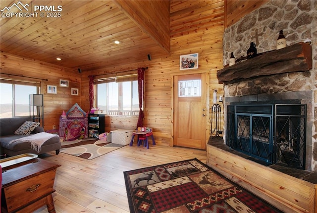 1160 Diamond Back Trl, Canon City, CO 81212 - living room with hardwood / wood-style floors, wood ceiling, wood walls, and a fireplace