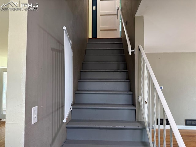 251 Fay Dr, Colorado Springs, CO 80911 - staircase with baseboards and wood finished floors