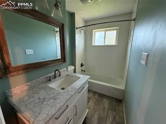 251 Fay Dr, Colorado Springs, CO 80911 - full bath featuring wood finished floors, vanity, and  shower combination