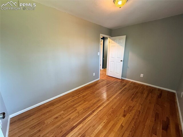 251 Fay Dr, Colorado Springs, CO 80911 - spare room featuring baseboards and wood finished floors