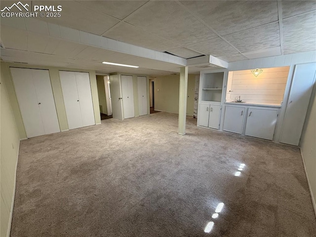 251 Fay Dr, Colorado Springs, CO 80911 - unfurnished living room featuring carpet flooring and a sink