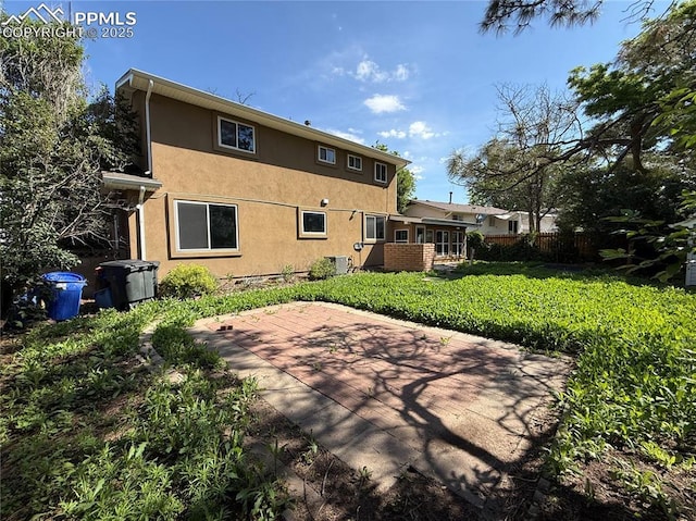 251 Fay Dr, Colorado Springs, CO 80911 - rear view of property with stucco siding and a patio