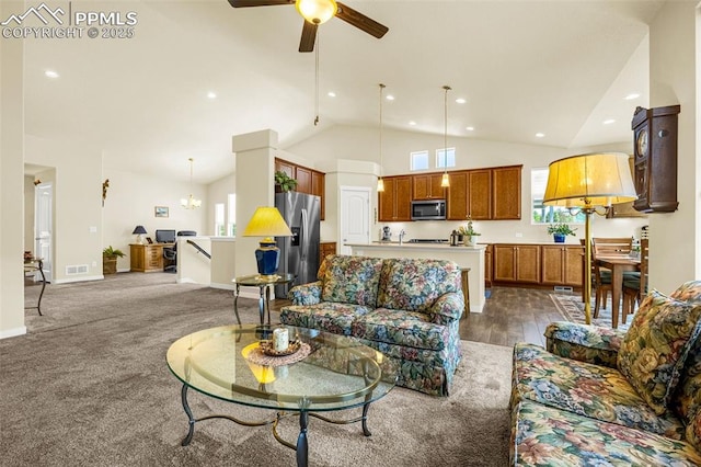 2997 Bright Moon Dr, Colorado Springs, CO 80908 - living area with plenty of natural light, a ceiling fan, recessed lighting, dark carpet, and high vaulted ceiling