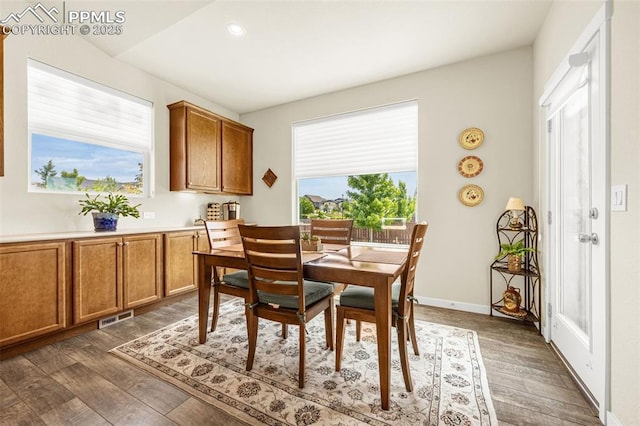 2997 Bright Moon Dr, Colorado Springs, CO 80908 - dining space featuring dark wood-type flooring and recessed lighting
