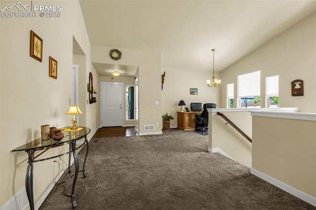 2997 Bright Moon Dr, Colorado Springs, CO 80908 - carpeted entryway with lofted ceiling and a chandelier