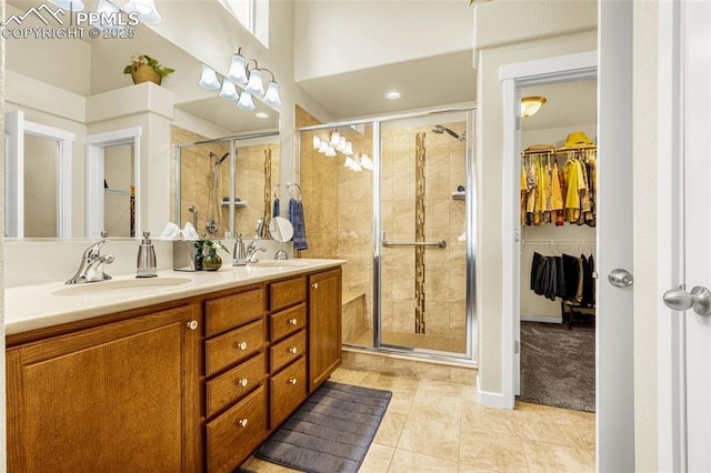 2997 Bright Moon Dr, Colorado Springs, CO 80908 - bathroom with a stall shower, a spacious closet, double vanity, and tile patterned floors