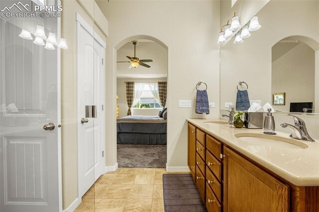 2997 Bright Moon Dr, Colorado Springs, CO 80908 - bathroom with ensuite bath, double vanity, ceiling fan, and tile patterned floors