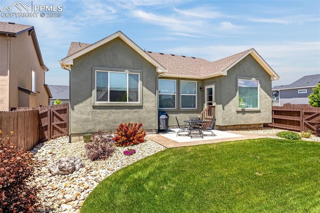 2997 Bright Moon Dr, Colorado Springs, CO 80908 - rear view of house with stucco siding, a fenced backyard, and a patio area